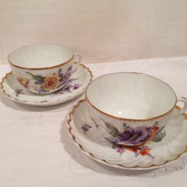 Six Nymphenburg cups and saucers, each painted differently