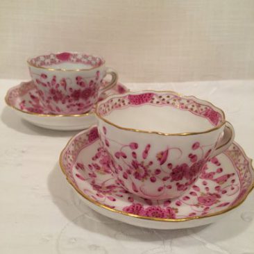 Seven Meissen purple Indian demitasse cups and saucers